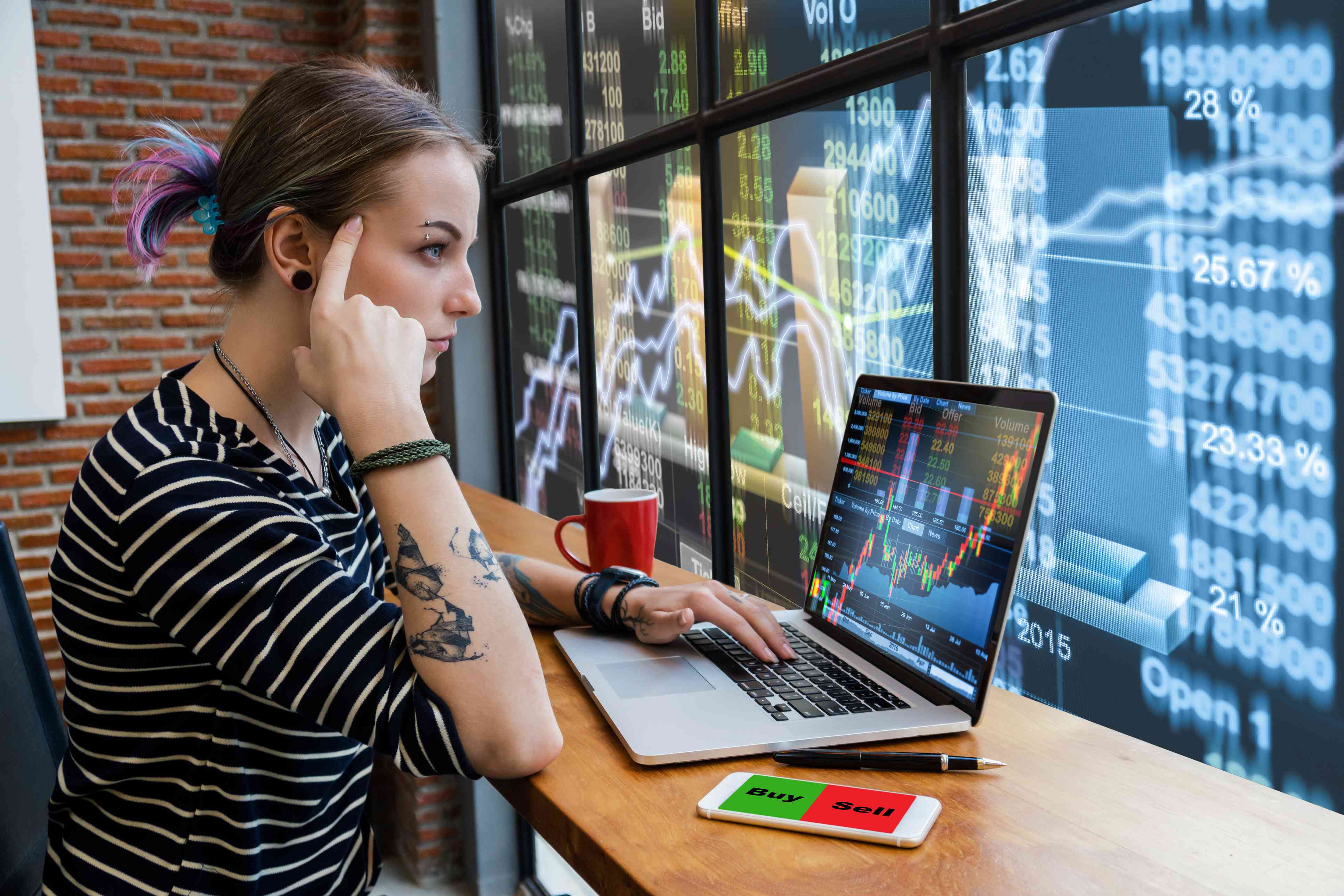 Woman Looks at Trading Screen on Laptop